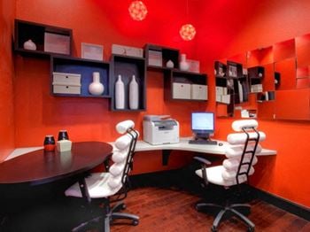 Two business centers with workstations and printer/copy/fax